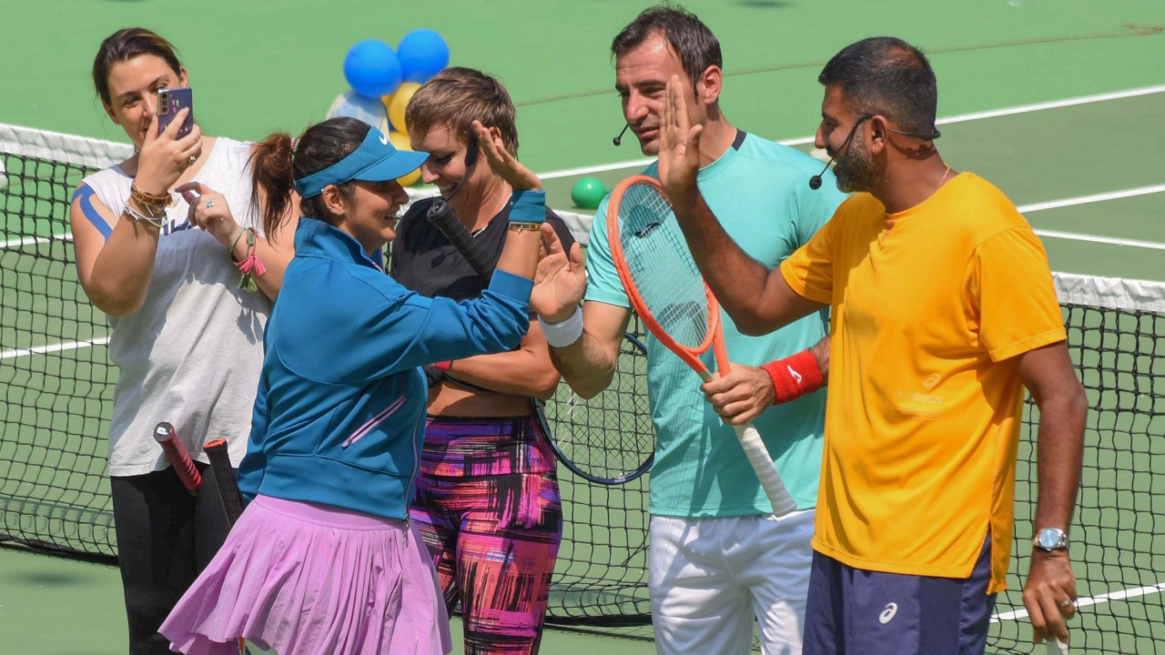 Sania Mirza bids her farewell to fellow players Rohan Bopanna, Cara Black and Bethanie Mattek during her farewell match at the Lal Bahadur Stadium, in Hyderabad. Credit: PTI Photo