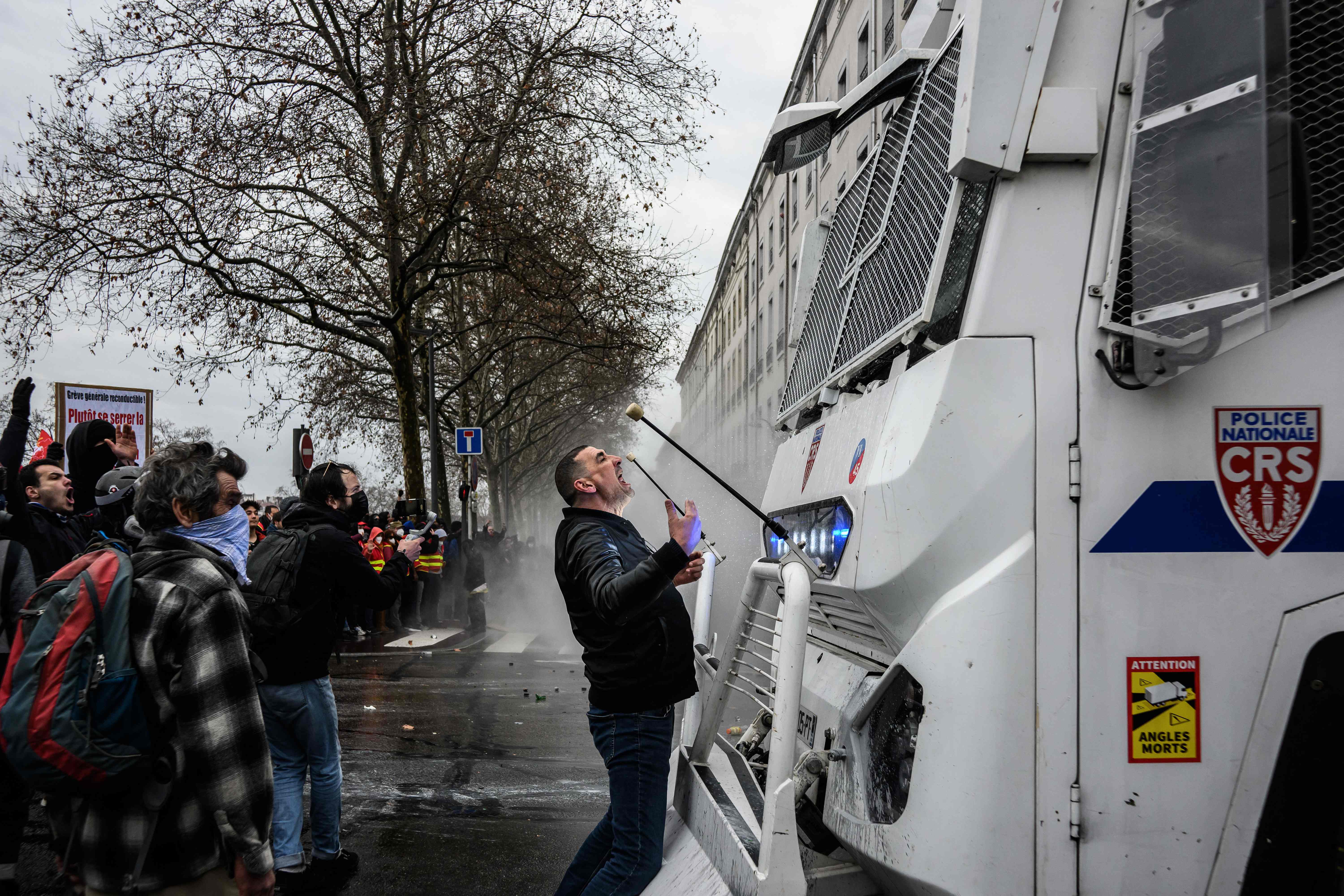 A man shouts at a police water truck driver during clashes with policemen during a demonstration in Lyon, central eastern France. Credit: AFP Photo