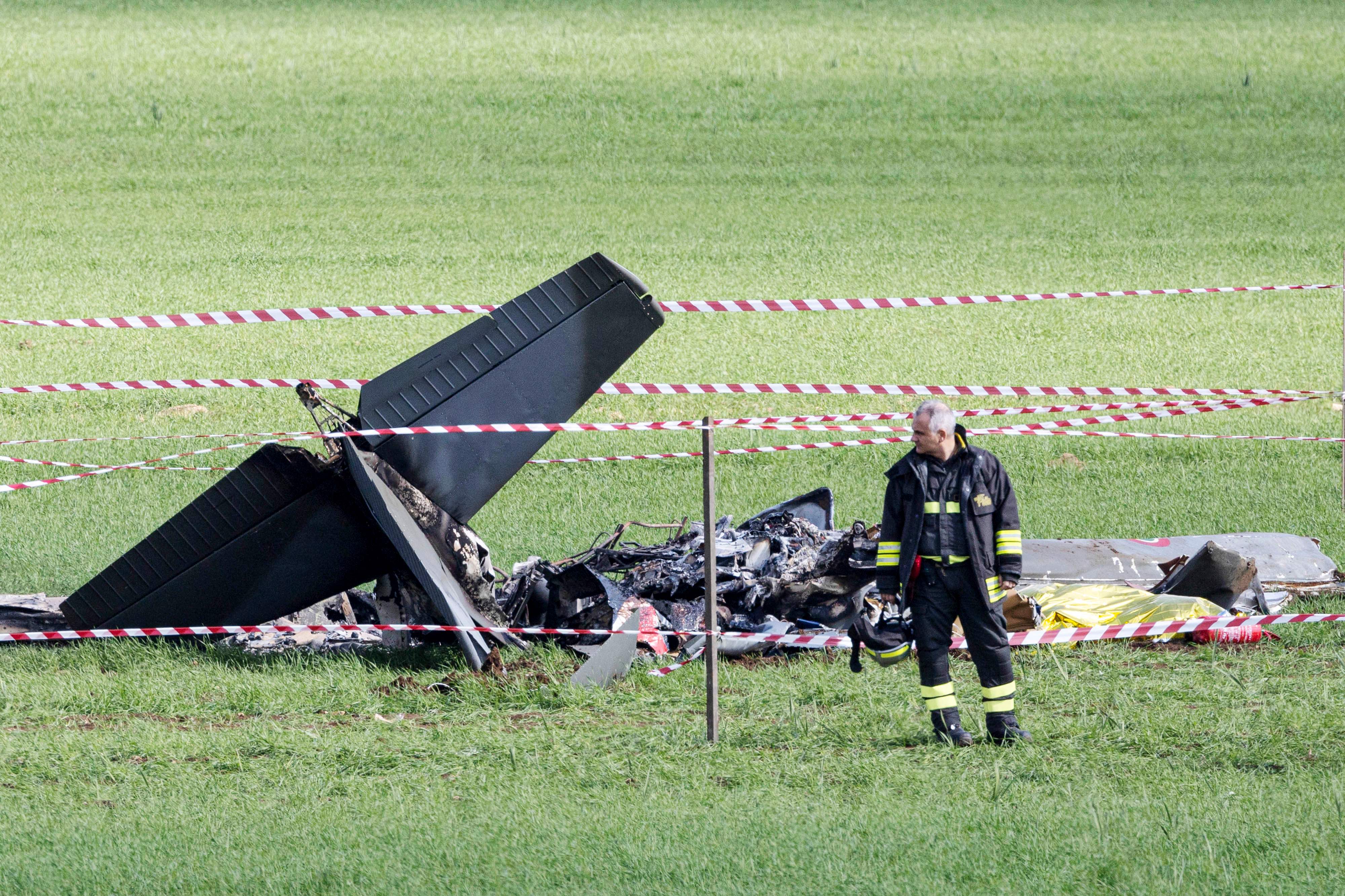 The wreckage of an Italian Air Force U-208 airplane is seen on the ground after collides on with another airplane in Guidonia, around 30 km south-est Rome during a training session. Credit: AFP Photo