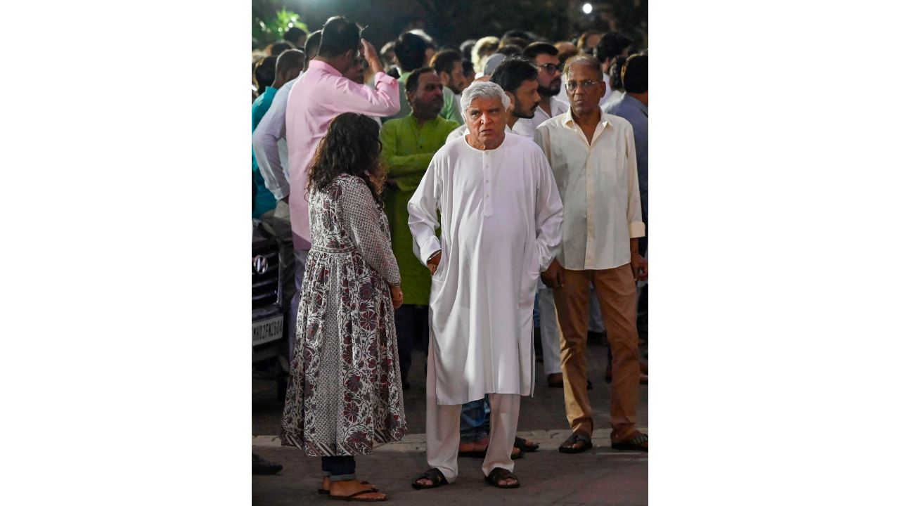 Javed Akhtar gets clicked during the funeral of Satish Kaushik in Mumbai. Credit: PTI Photo