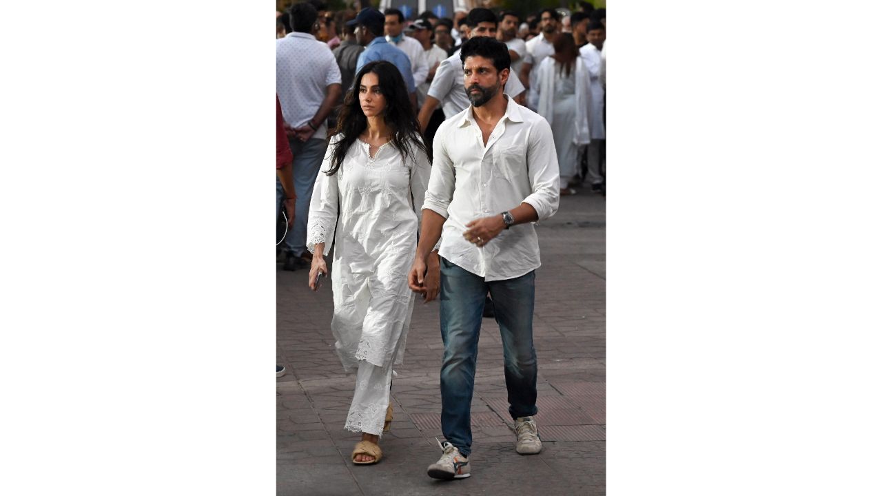 Farhan Akhtar and wife Shibani Dandekar attend the funeral of Satish Kaushik in Mumbai. Credit: PTI Photo