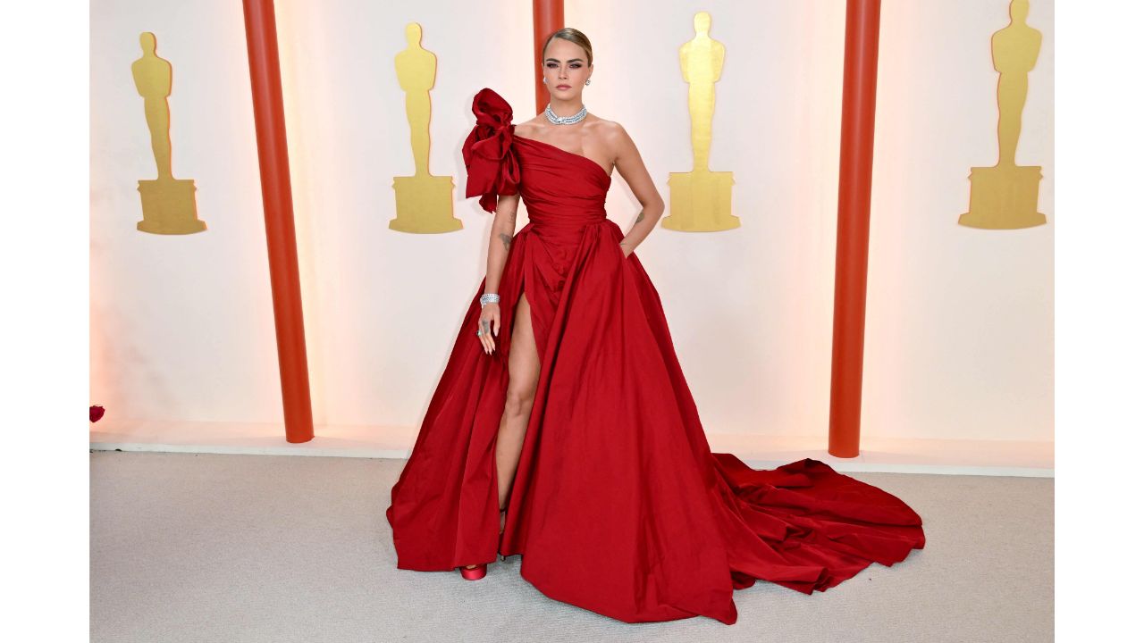 Cara Delevingne wore a one-shoulder Elie Saab dress with a high leg slit. Credit: AFP Photo