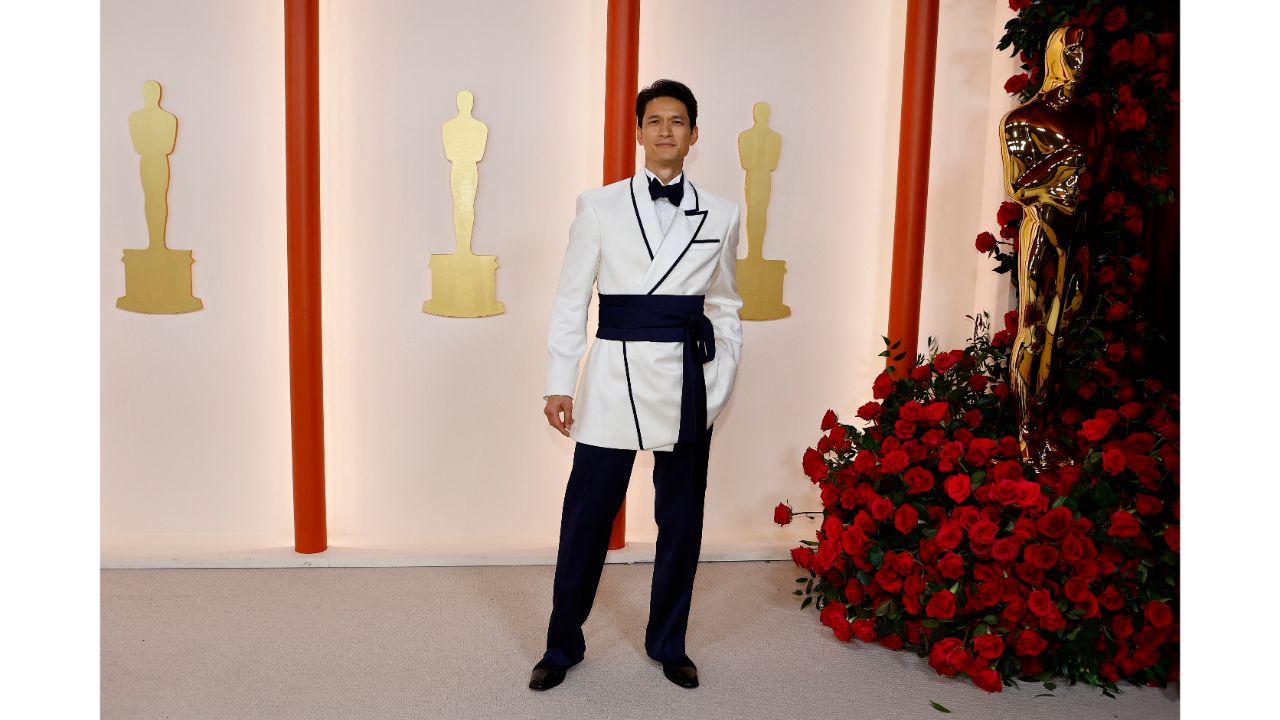 American actor Harry Shum Jr was seen in a custom tuxedo by Adeam. The loose fit, asymmetrical lapel, navy piping and sash belt made the outfit more attractive. Credit: Reuters Photo