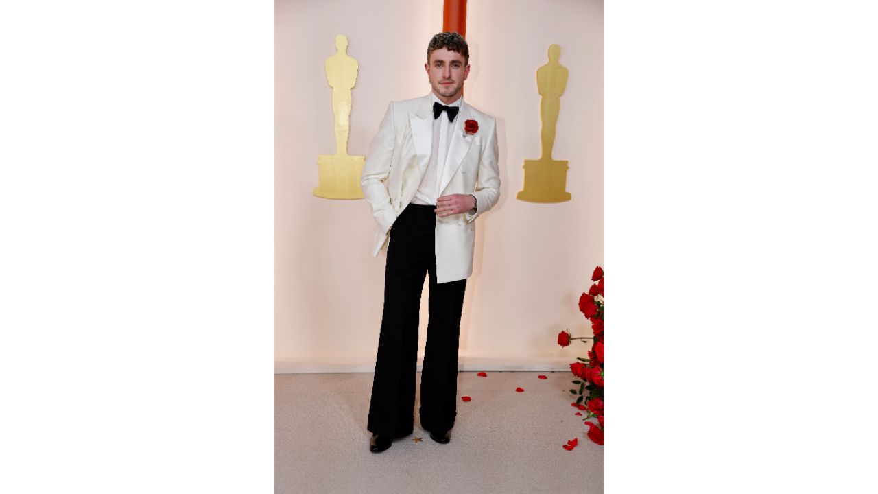 Paul Mescal looked refreshingly retro and ready for prom in his white Gucci dinner jacket, with a rose on the lapel, and flared black trousers. Credit: Reuters Photo