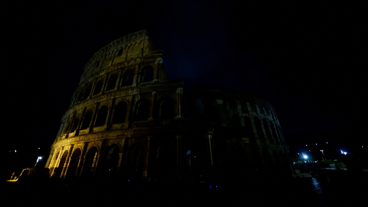The ancient Colosseum is seen after the lights are switched off for Earth Hour in Rome, Italy. Credit: Reuters Photo