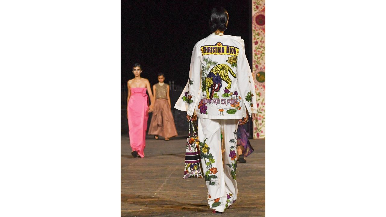 Models present creations from Christian Dior's Fall 2023 collection during a fashion show in Mumbai. Credit: AFP Photo