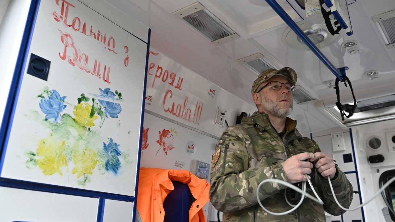 Ambulance driver Said Ismagilov, formerly one of Ukraine's Muslim spiritual leaders, checks equipment in his car near the eastern front line in Ukraine. Credit: AFP Photo