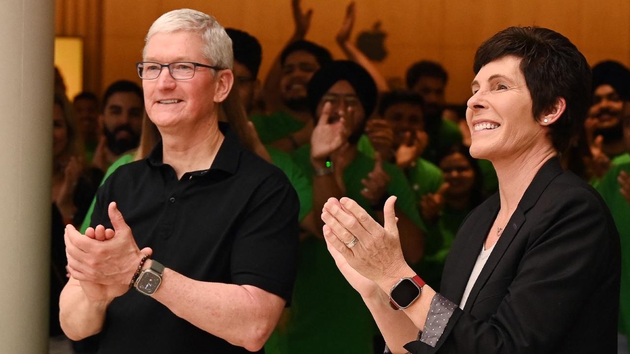 Chief Executive Officer of Apple Tim Cook (L) and Apple's Senior Vice President of Retail and People Deirdre O'Brien clap during the opening of an Apple retail store at a mall in New Delhi. Credit: AFP Photo
