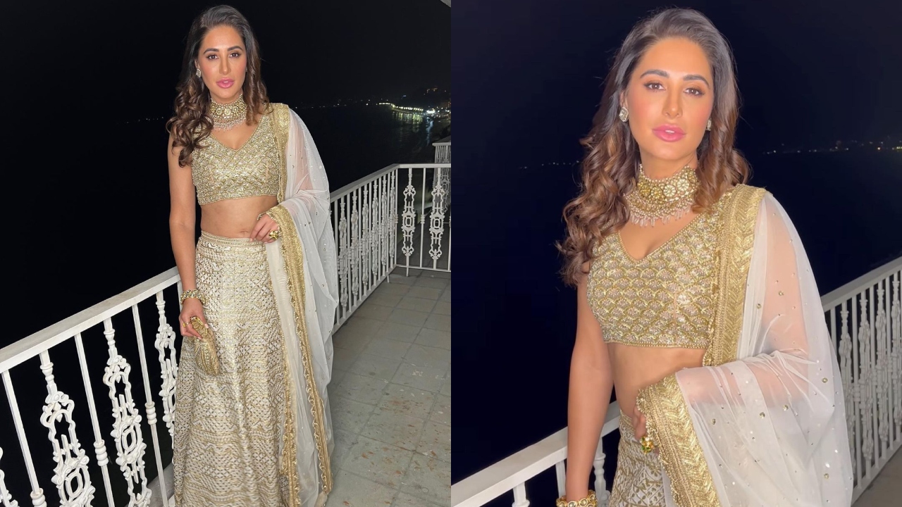 Bollywood actress Nargis Fakhri looks mesmerising in an ivory and gold cutwork classic lehanga by ace designer Bhumika Grover. Credit: Instagram/@bhumikagrover