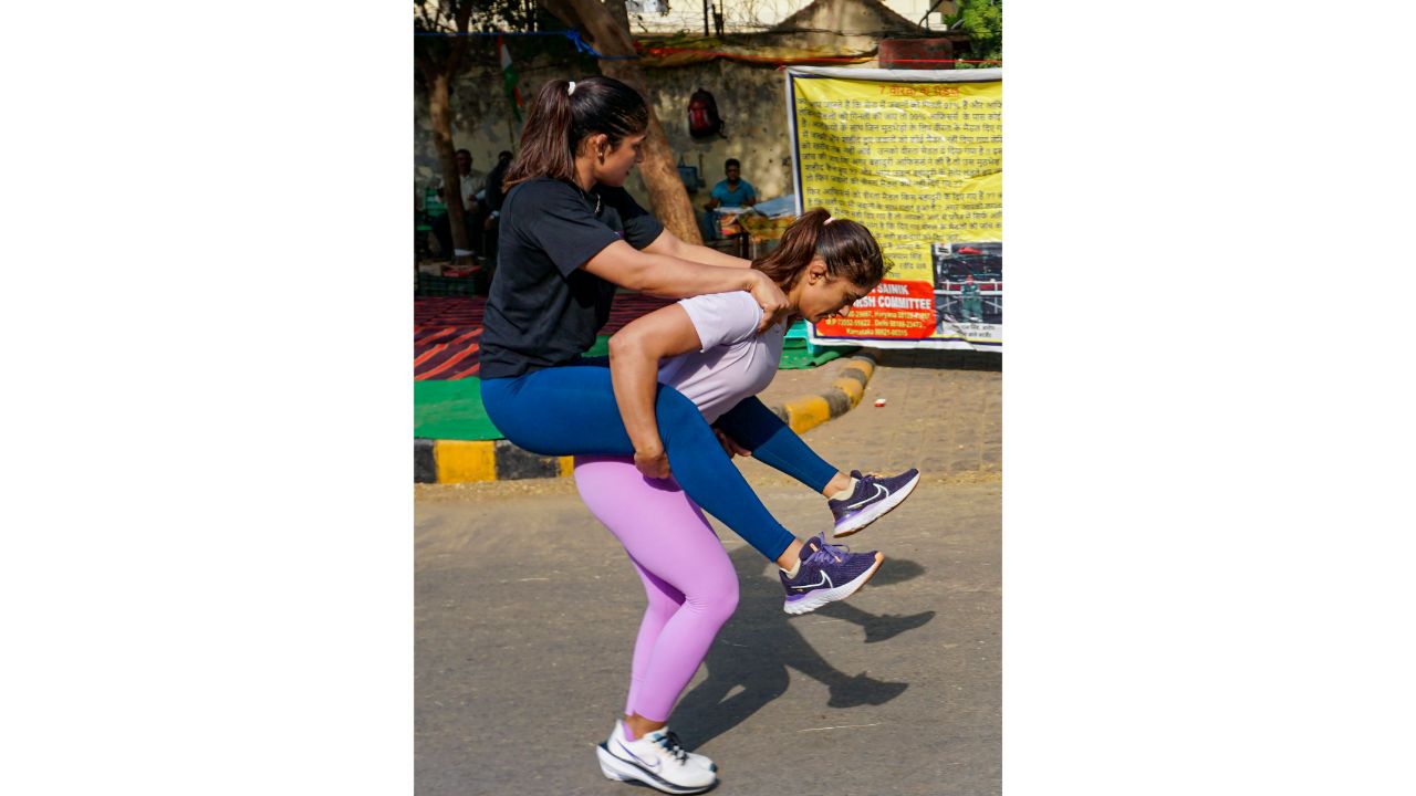 Wrestlers Vinesh Phogat and Sangita Phogat during a training session near Jantar Mantar amid their protest, in New Delhi. Credit: PTI Photo