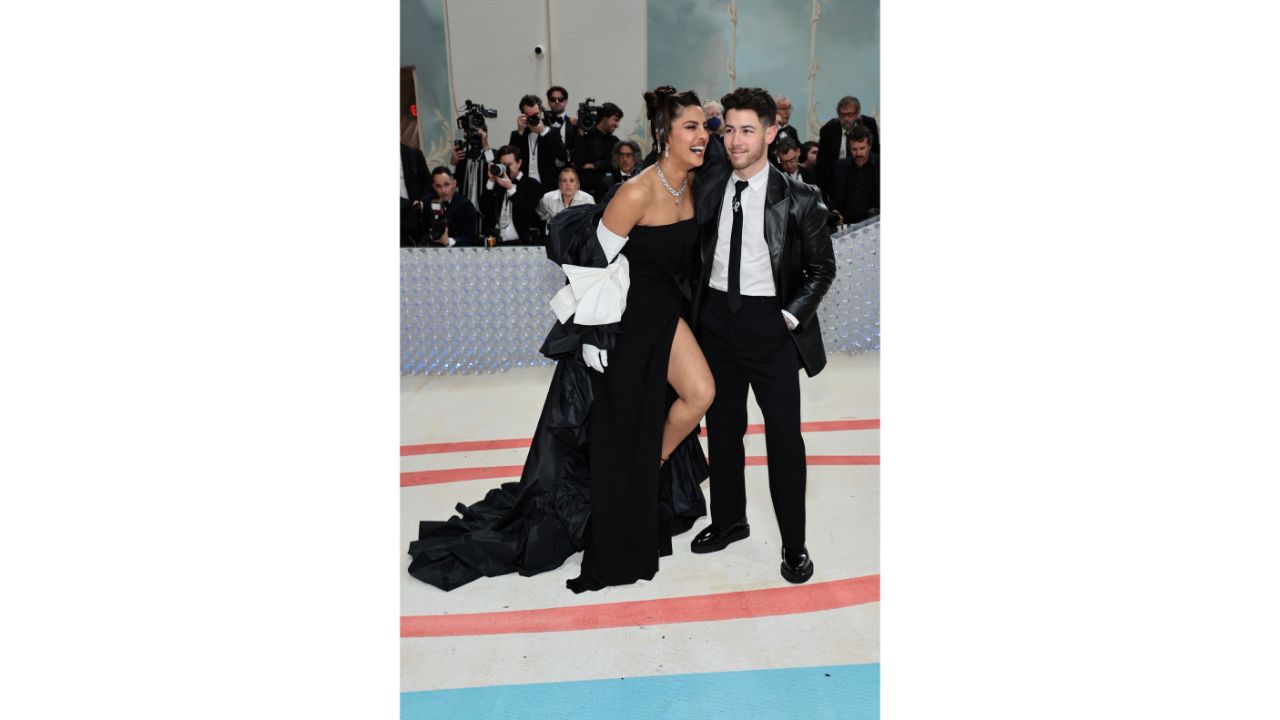 Priyanka and Nick are seen enjoying a wise crack. Credit: AFP Photo