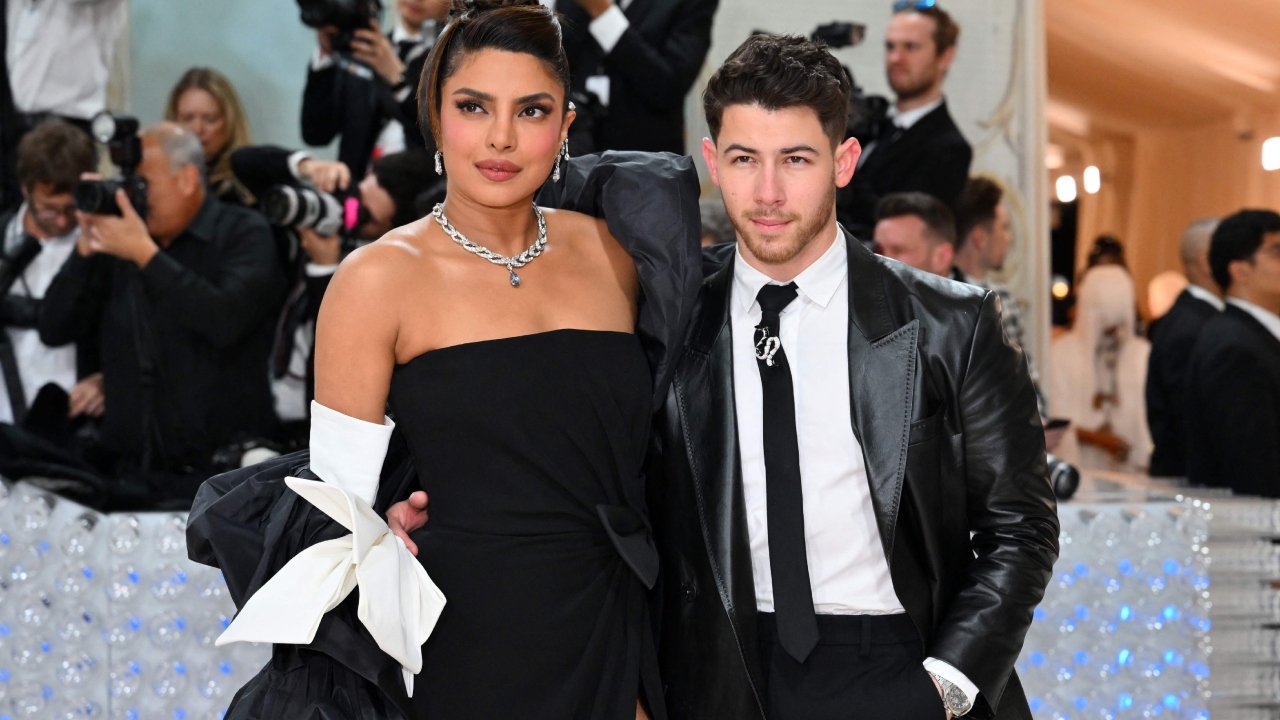 Priyanka Chopra Jonas and Nick Jonas pose on their arrival. Credit: AFP Photo