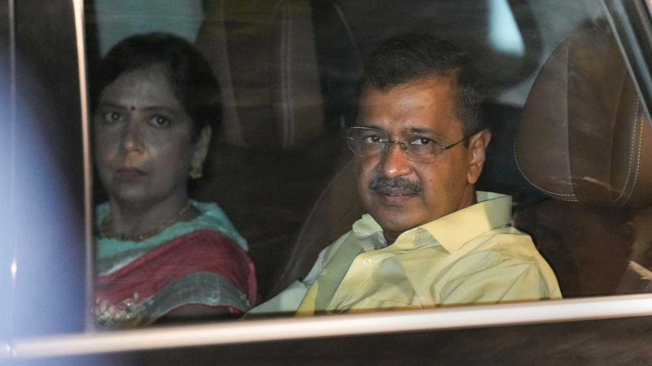 Delhi CM Arvind Kejriwal smiled at the cameras as he left the function. Credit: PTI Photo
