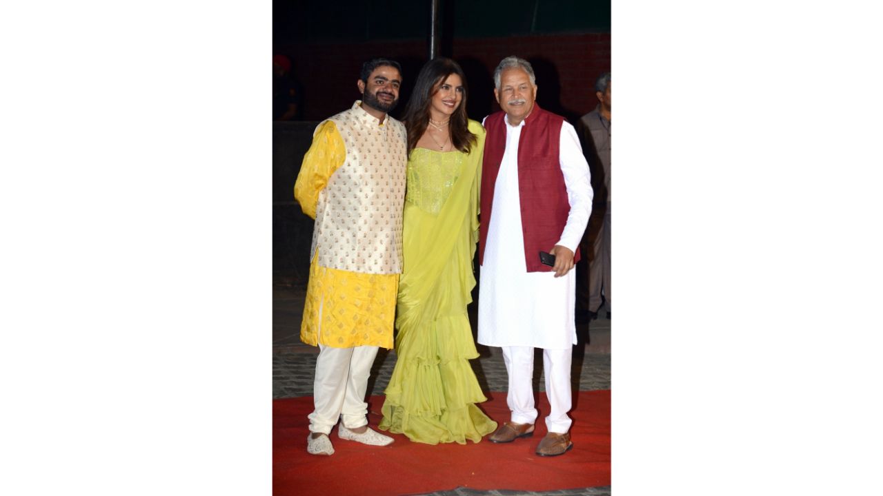 Priyanka also happily posed with her brother and Parineeti's father Pawan Chopra. Credit: Anupam Gautam/IANS