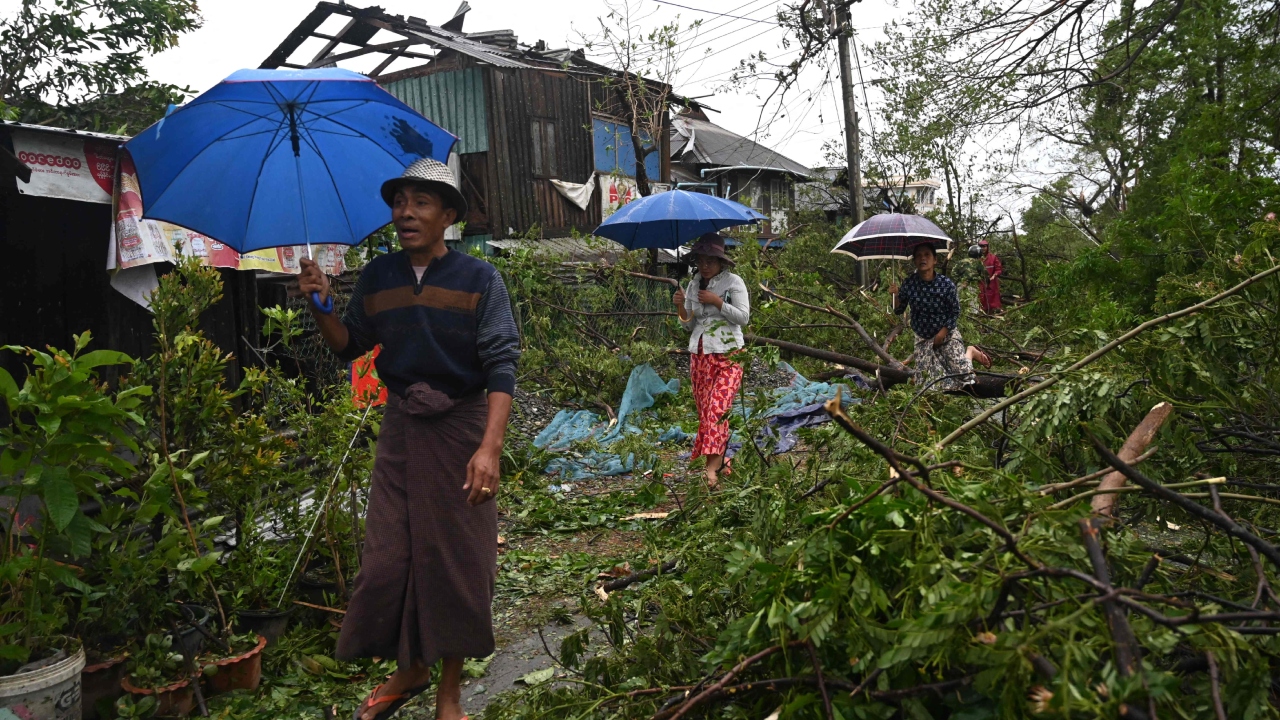 High winds crumpled cell phone towers, but in videos collected by local media before communications were lost, deep water raced through streets and wind blew off roofs. Credit: AFP Photo