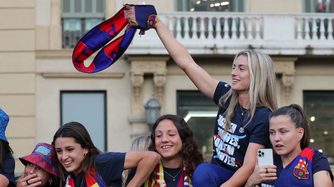 The women carried the slogan “We play together, we win together