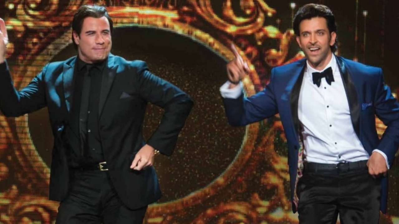 John Travolta is seen matching steps with the 'Greek God of Bollywood' Hrithik Roshan at the IIFA awards. Credit: IIFA