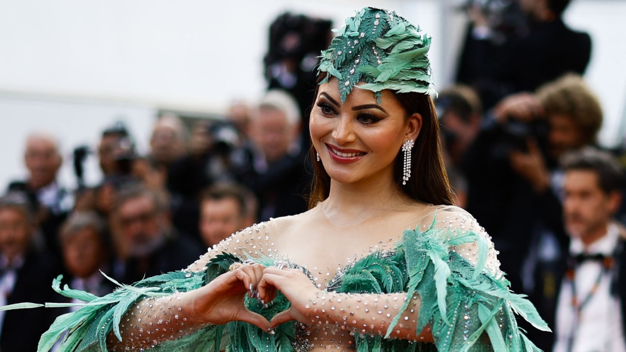 She accessorised her outfit with dangling earrings and multiple rings with a nude makeup look, bold eye makeup and heavy contouring. Credit: Reuters Photo