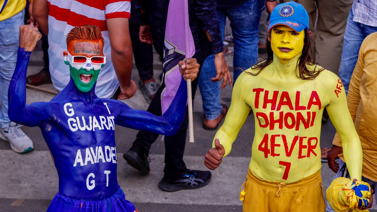Cricket fans wait to get entry to the Narendra Modi Stadium for the IPL 2023 final match between Gujarat Titans and Chennai Super Kings, in Ahmedabad. Credit: PTI Photo