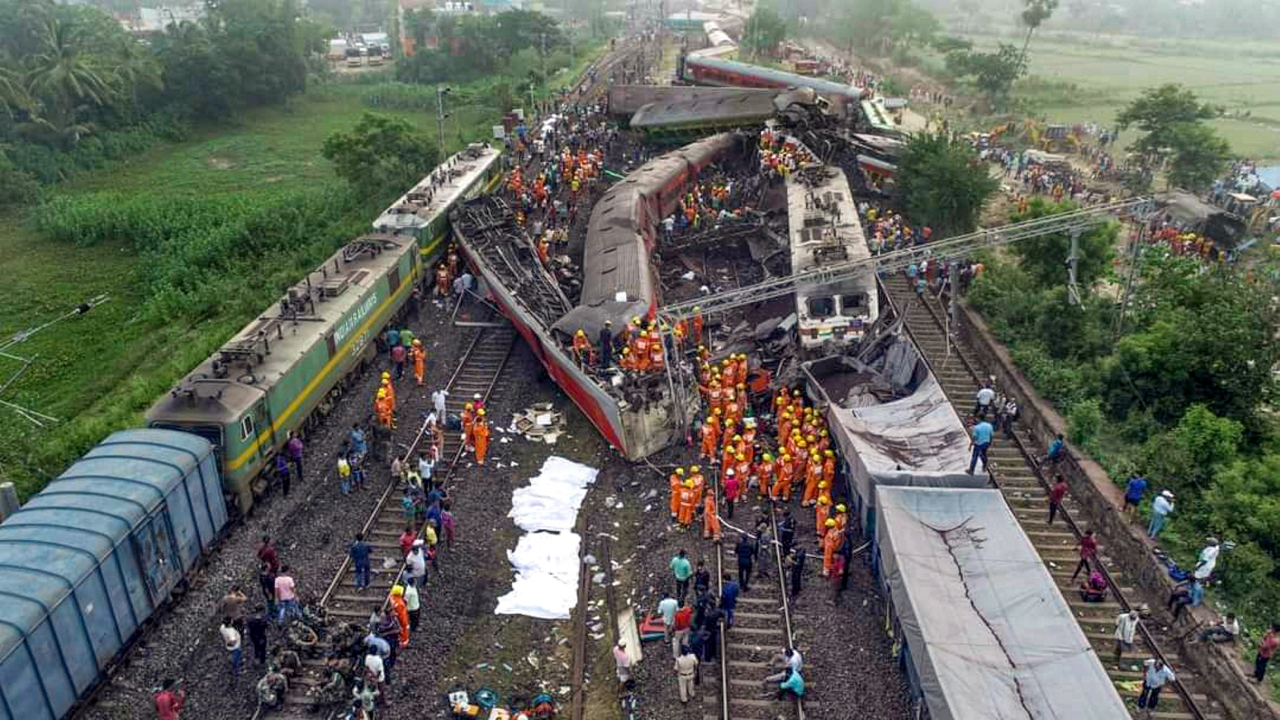 Locals, security personnel and NDRF during the search and rescue operation at the site of tragedy. Credit: PTI Photo