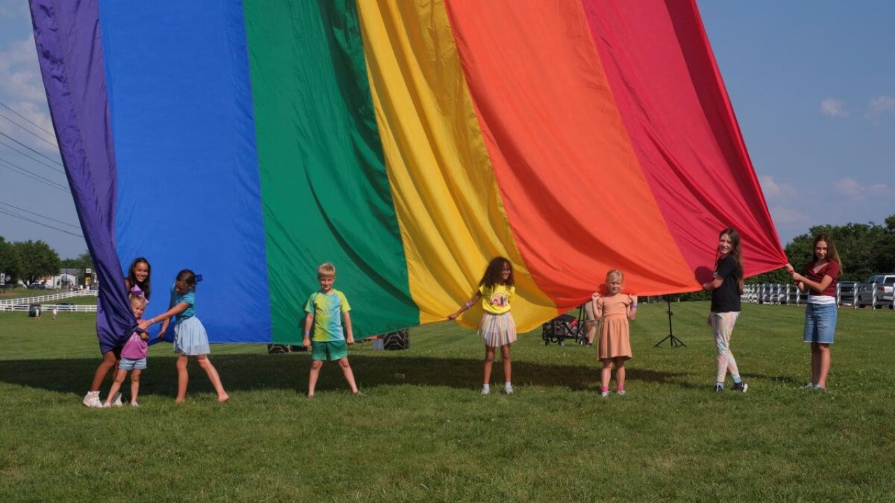 Children of attendees hold the rainbow flag during an all ages LGBTQ Pride event in Franklin, Tennessee, U.S., June 3, 2023. Credit: Reuters