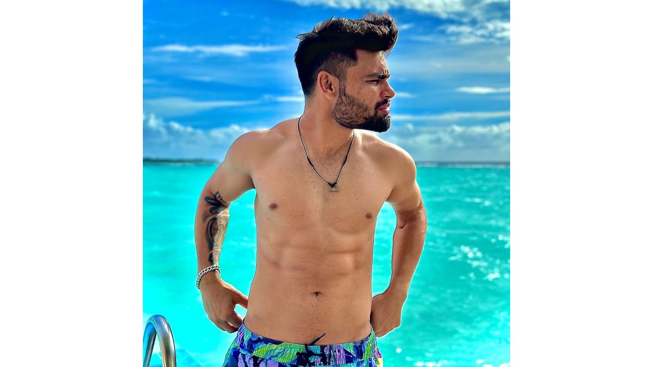 The star cricketer shared a series of shirtless pictures amid the picturesque background. The vacation was organised by travel company HappyTickets Pvt Ltd. Credit: Instagram/@rinkukumar12