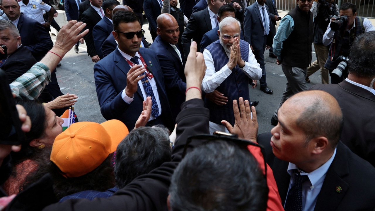 Modi also autographed pictures of him and greeted the supporters. Credit: Reuters Photo