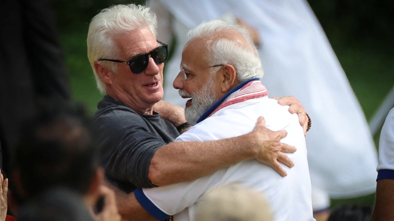 PM Modi embraces actor Richard Gere as they attend the 9th International Day of Yoga event on the north lawn at United Nations headquarters in New York City. Credit: Reuters Photo