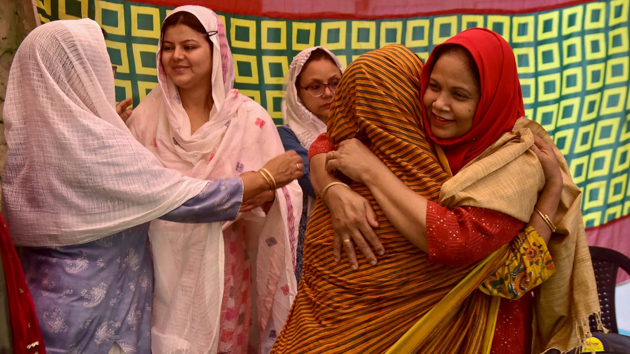 Muslim women greet each other after offering 'namaz' on the occasion of the 'Eid al-Adha' festival, in Guwahati. Credit: PTI Photo