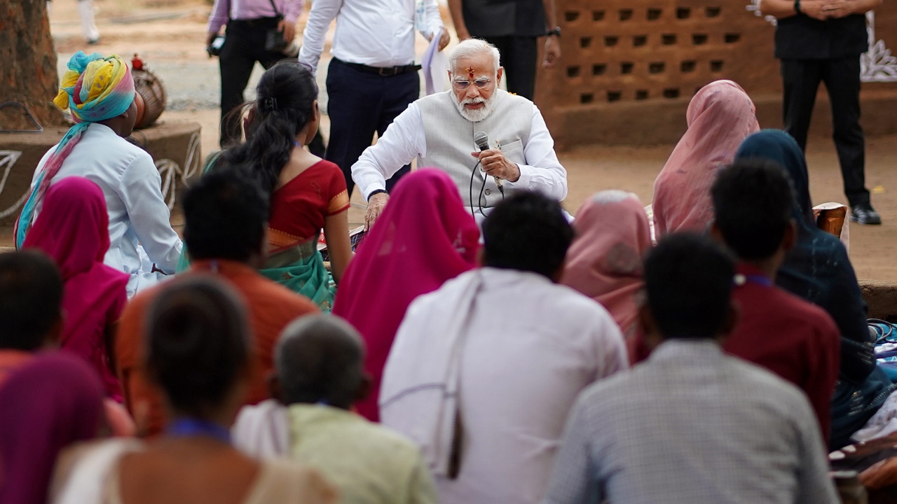 He interacted with a group of people including women who informed him about their journey to economic empowerment through SHGs and Ajivika Mission. Credit: PTI Photo