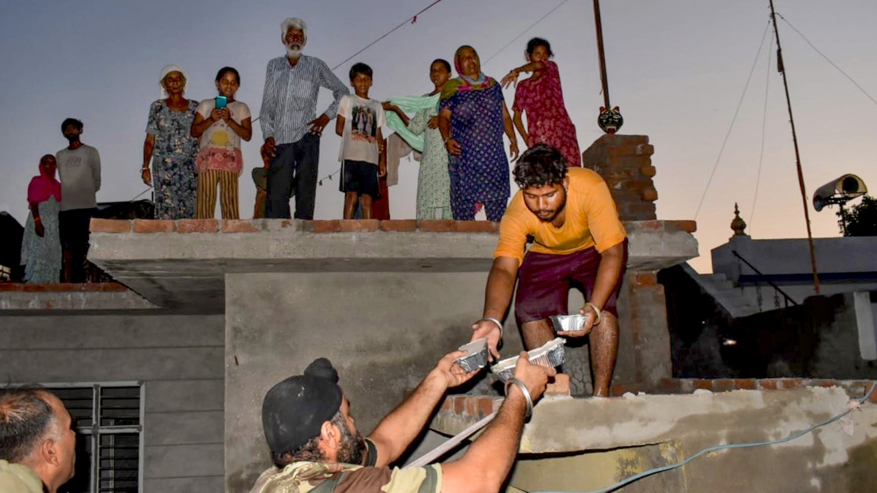 Relief measures under way in Punjab and Haryana on Wednesday as several parts of the states remained flooded following incessant rains in the past three days. Credit: PTI Photo