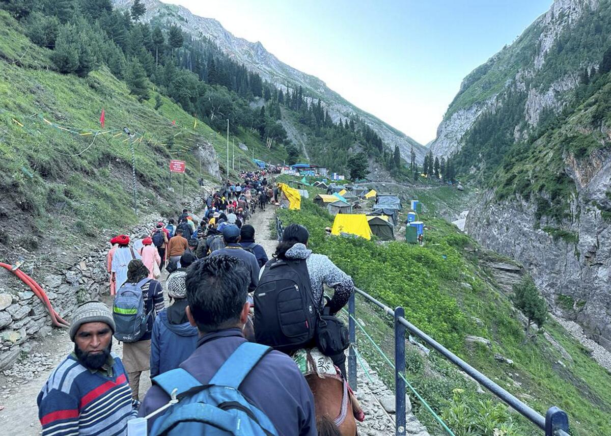 Pilgrims at Brarimarg on the way to the holy Amarnath shrine, in Baltal, Jammu & Kashmir. Credit: PTI Photo