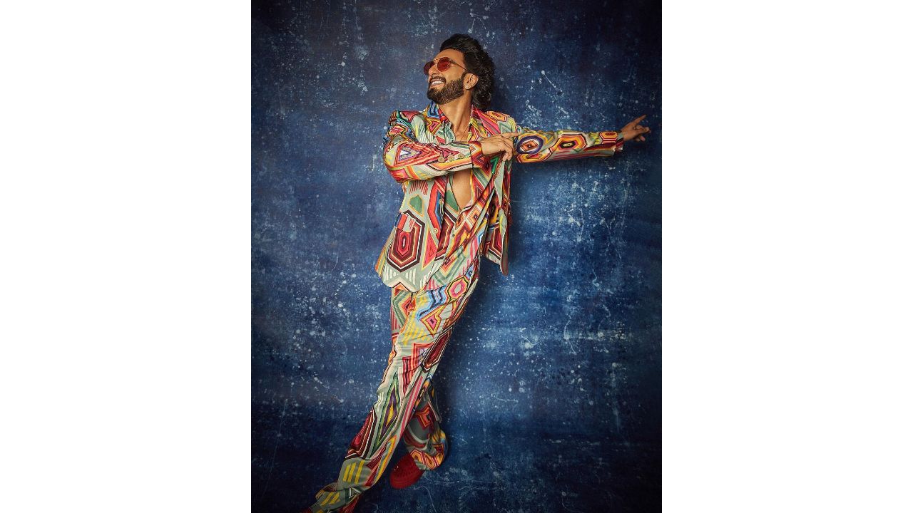 When it comes to pushing fashion boundaries, Ranveer Singh reigns supreme, and his funky patterned co-ord set was no exception. Embracing the outfit with unwavering confidence, Ranveer combined bold colours and eye-catching designs that perfectly captured his flamboyant persona. Adding to the audacious ensemble, he sported bold red shoes and rocked red-tinted glasses. Credit: Instagram/@ranveersingh