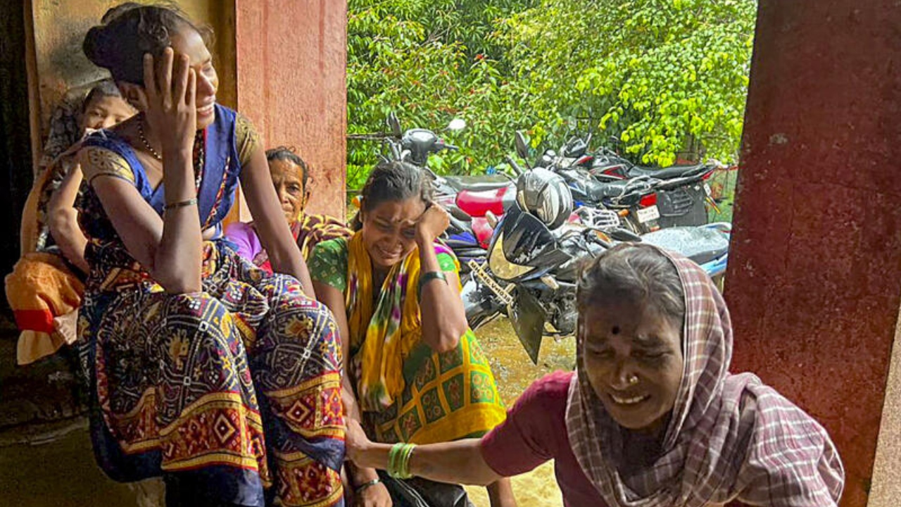 Family members of the people trapped under the rubble after a landslide at Irshalwadi village in Raigad district, Thursday, July 20, 2023. Credit: PTI Photo