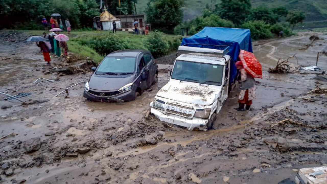 Vehicles stuck in debris after a cloudburst at Rohru area in Shimla district, Saturday, July 22, 2023. Credit: PTI Photo