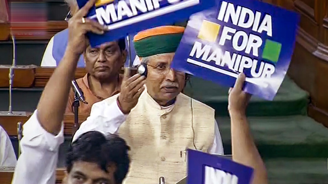 Opposition MPs protest in the Lok Sabha demanding PM Narendra Modi's statement in the House on Manipur crisis during the Monsoon session of Parliament, in New Delhi, Tuesday, July 25, 2023. PTI Photo