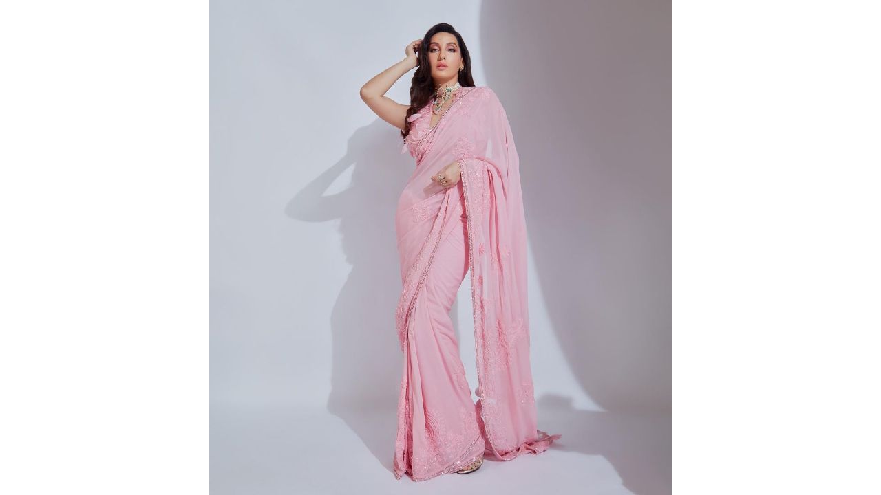 Actress Nora Fatehi is one of the stars who knows how to rock the sequin saree trend. She was spotted in a pink saree created by the iconic Manish Malhotra. The saree boasted a delicate balance of sequins, flowery thread embroidery, and sparkling diamond accents along the border. Credit: Instagram/@norafatehi