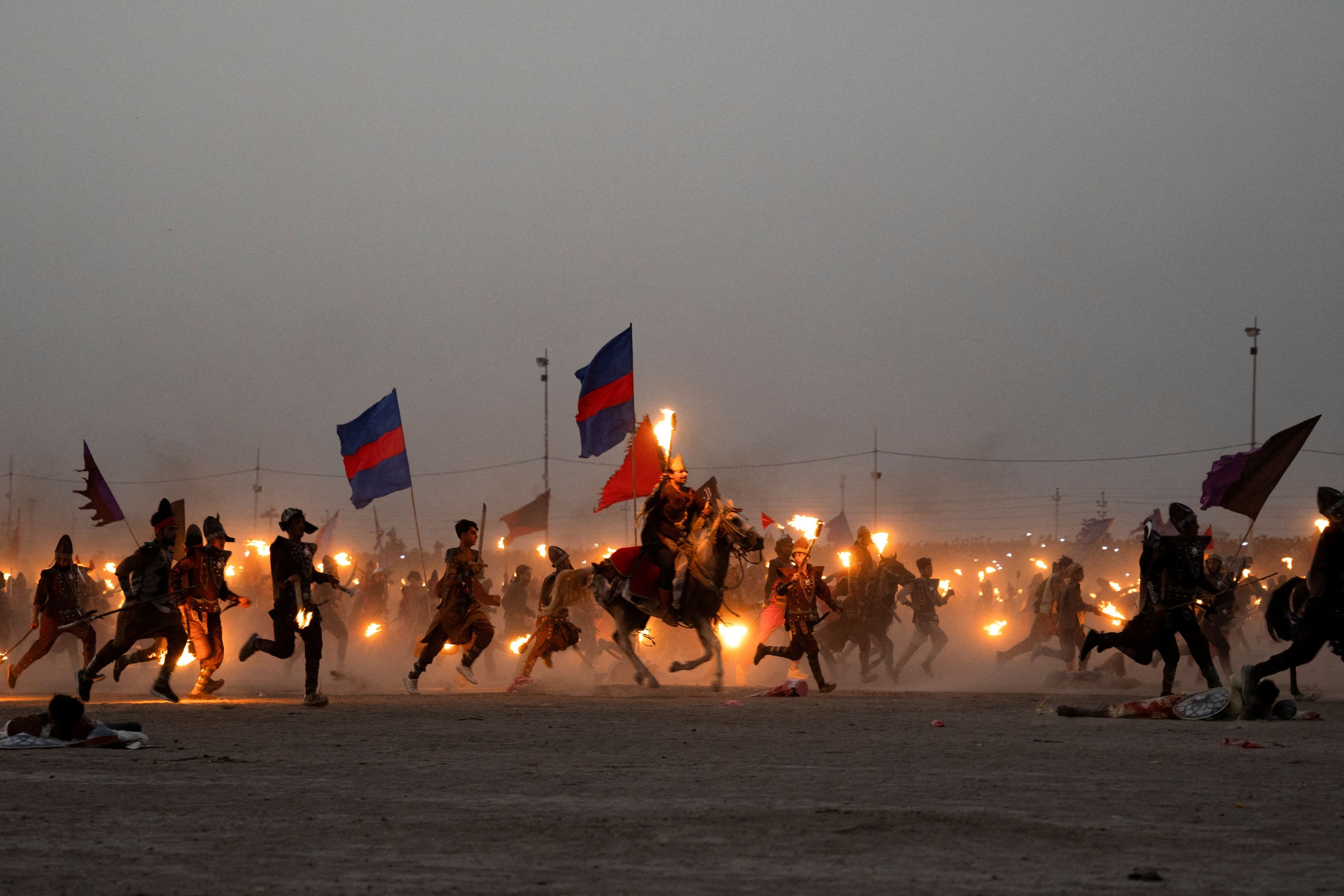 Re-enactment of a scene from the 7th century battle of Kerbala during the Shi'ite religious festival of Ashura in Suq Al-Shuyukh. Credit: Reuters Photo