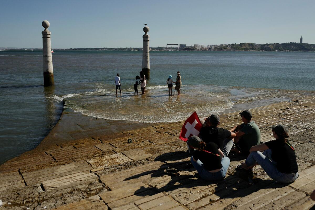 People stand in Cais das Colunas on the occasion of the XXXVII World Youth Day, in Lisbon. Credit: Reuters Photo