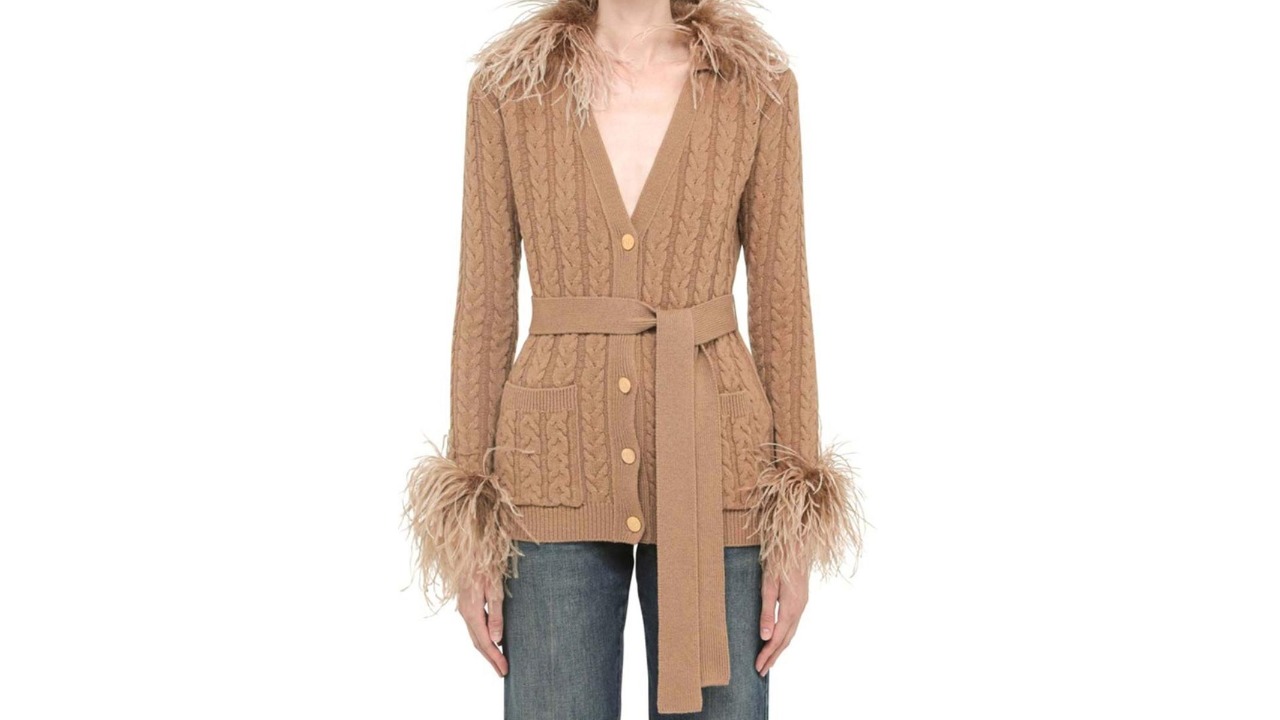 Feather touch: This is a beige feathered wool cardigan from Valentino Garavani. It comes with a belted waist and two front patch pockets.