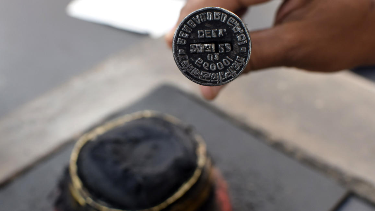 The numbers of the date have been changed everyday on this stamp for the last 150 years. A record book is maintained to log the dates each day. Credit: DH Photo