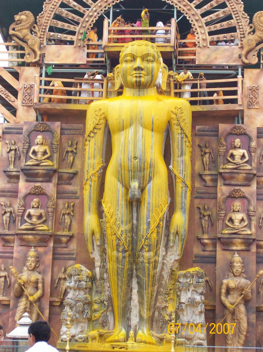 Witness: Maha Mastakabhisheka ceremony at Dharmastala; Brahmastamba ferried on a truck; installation of the Bahubali monolith atop Rathnagiri hill, priest conducting rituals while installing the monolith.