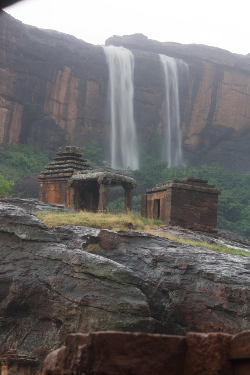 The ephemeral cataract that forms a backdrop to the temples.