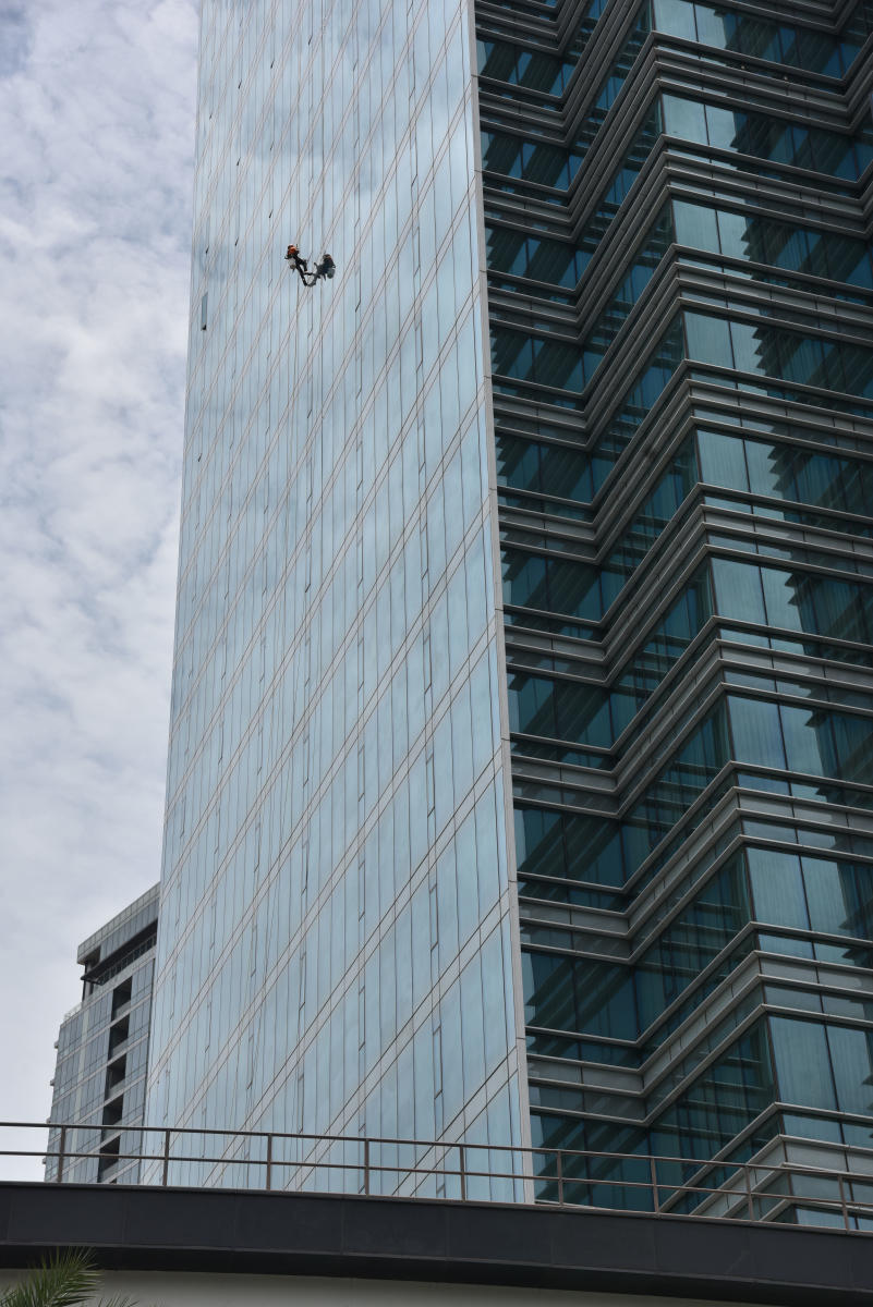 There are concerns that glass-facade buildings can reflect solar radiation into surrounding areas. Credit: DH File Photo