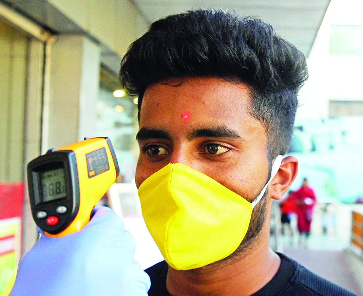 Body temperature checks at a supermarket