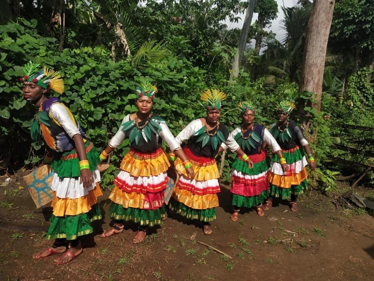 Siddi women prepare for Damami Kunita, the traditional folk dance; (below) a Siddi artiste; Jackey Siddi with the dholu. Photos by author