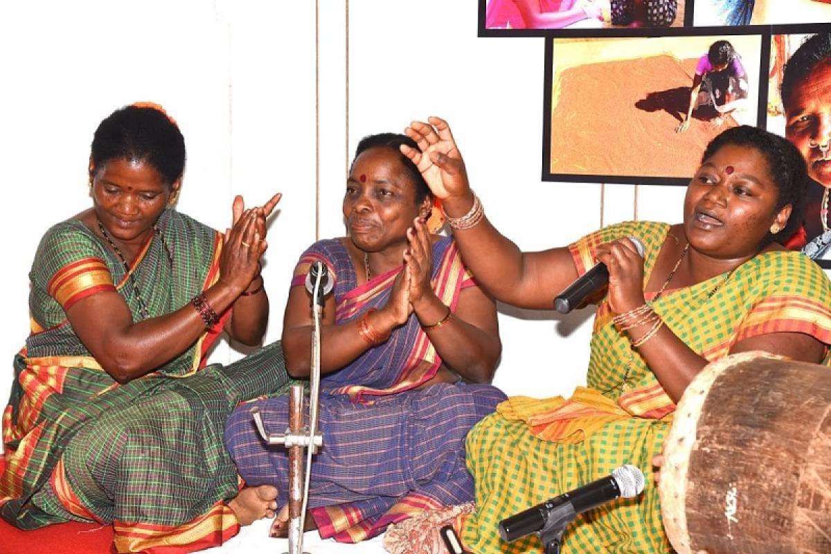 Members of the community prepare for the traditional folk dance