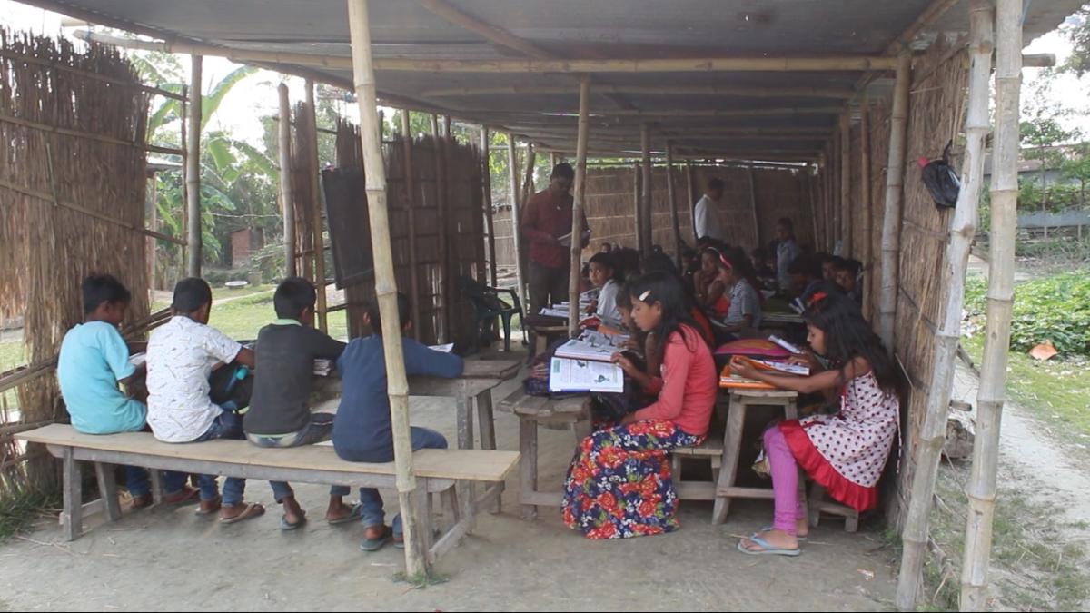 Children in parts of Assam are forced to study in make-shift schools as school buildings get destroyed due to erosion. Photo Credit: Indo Global Social Service Society