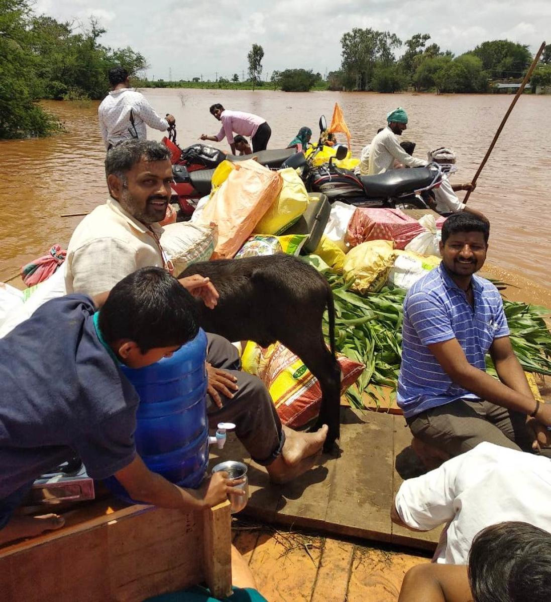 The residents of Muttur village in Jamkhandi taluk of Bagalkot district are shifted to a safer place on a boat. 