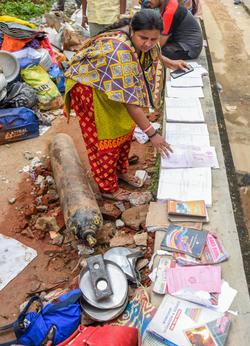 Residents trying to salvage their belongings. Credit: DH Photo